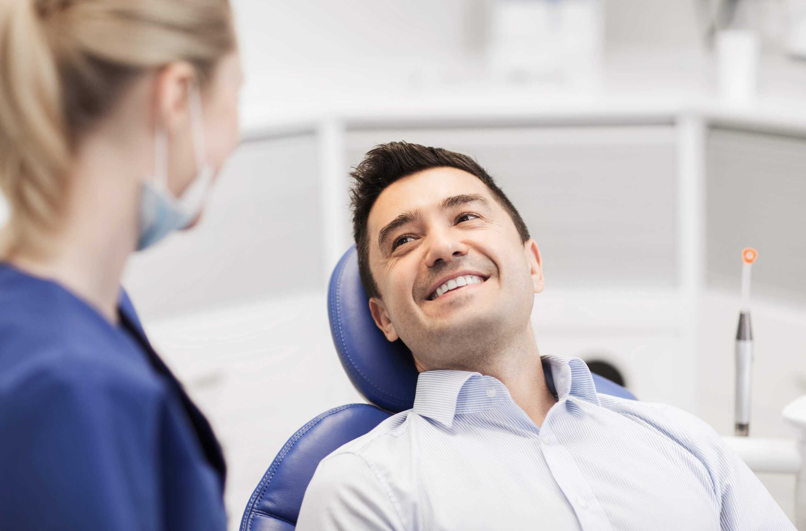 Happy patients staff in chair